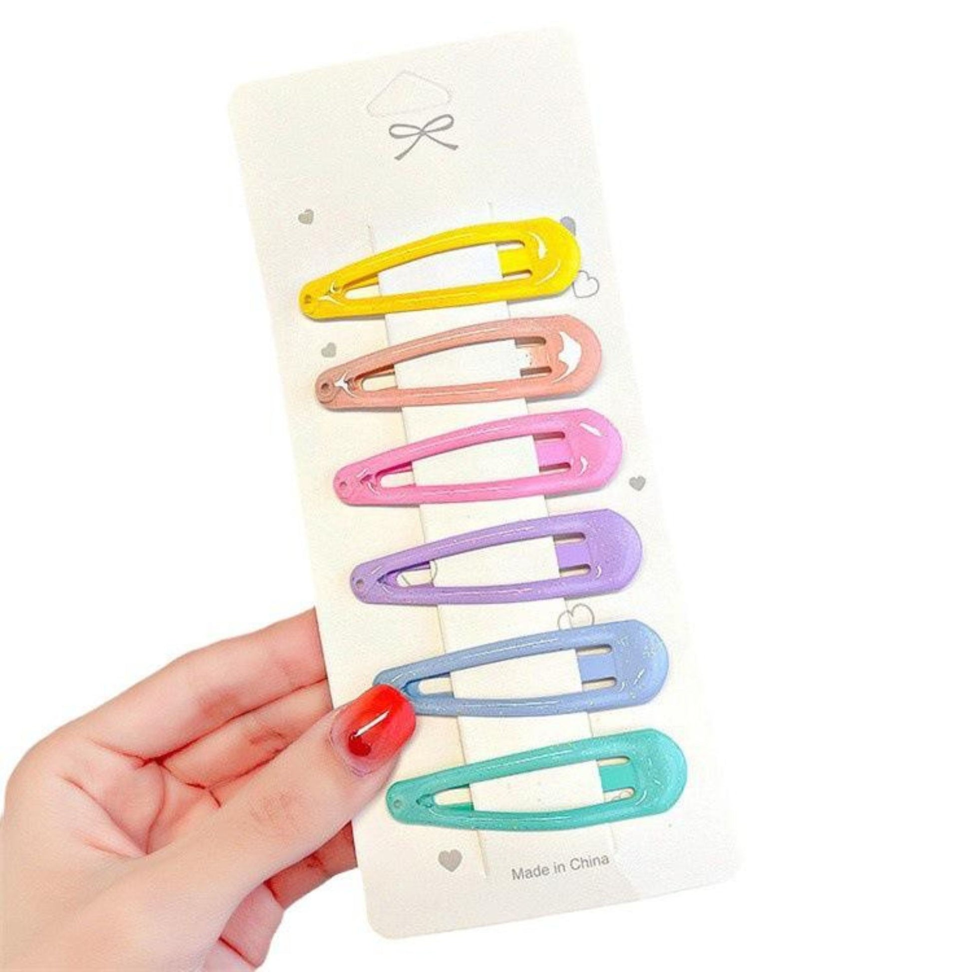 Smooth finish with strong snap closure Pack includes 6 pastel-colored snap hair clips