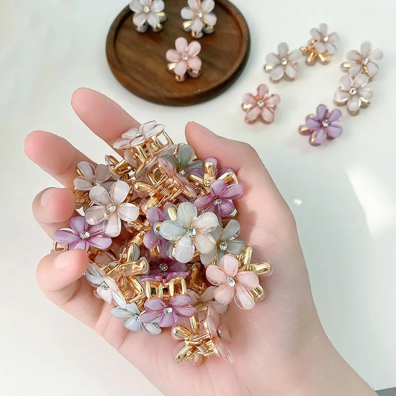 Mini  Holding a collection of floral hair clips