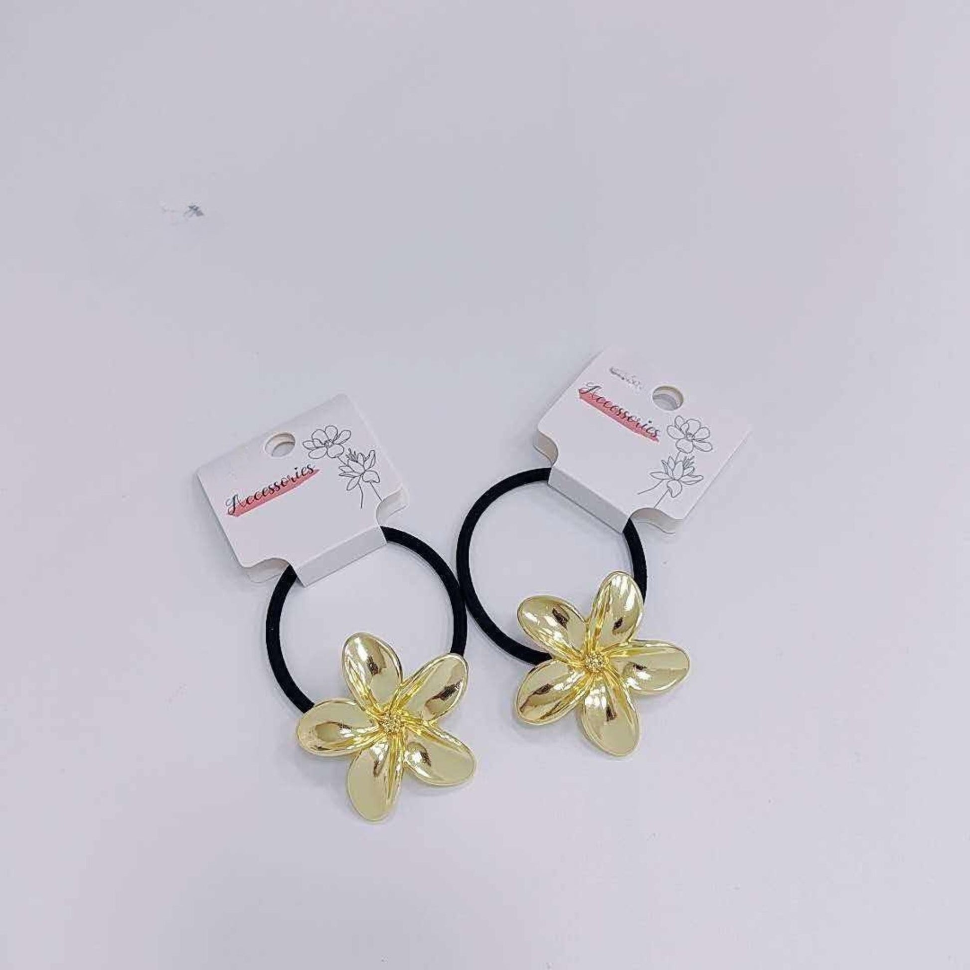 stylish hair ties
trendy hair accessories
floral design hair tie
ponytail holder for women
elegant hair accessory
fashion hair tie set